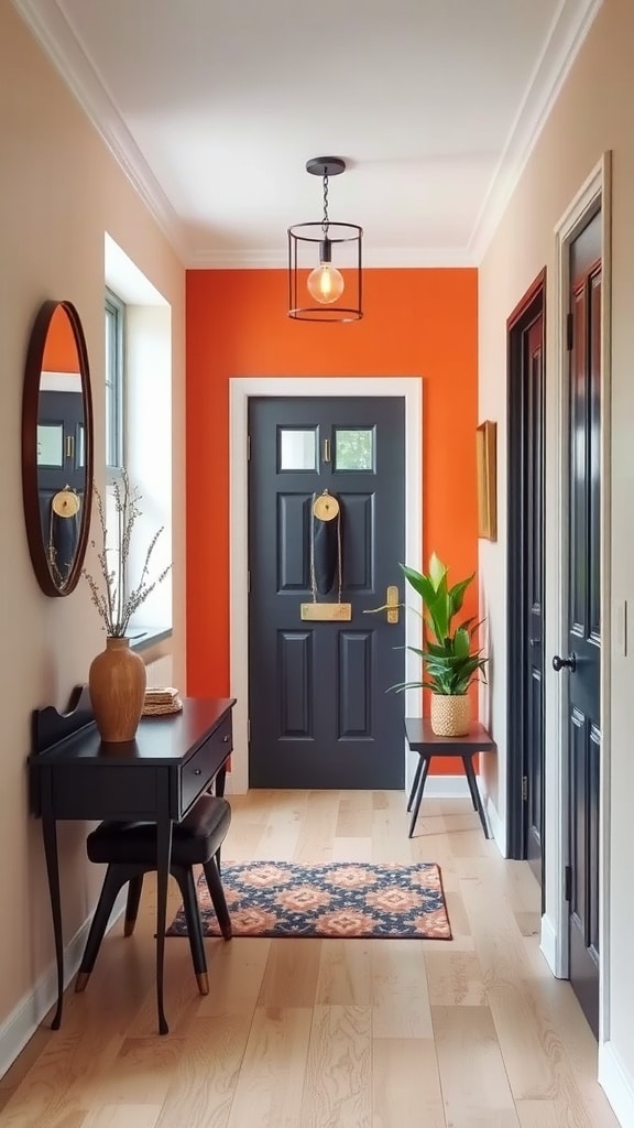 A hallway featuring a colorful orange accent wall, dark front door, and stylish decor